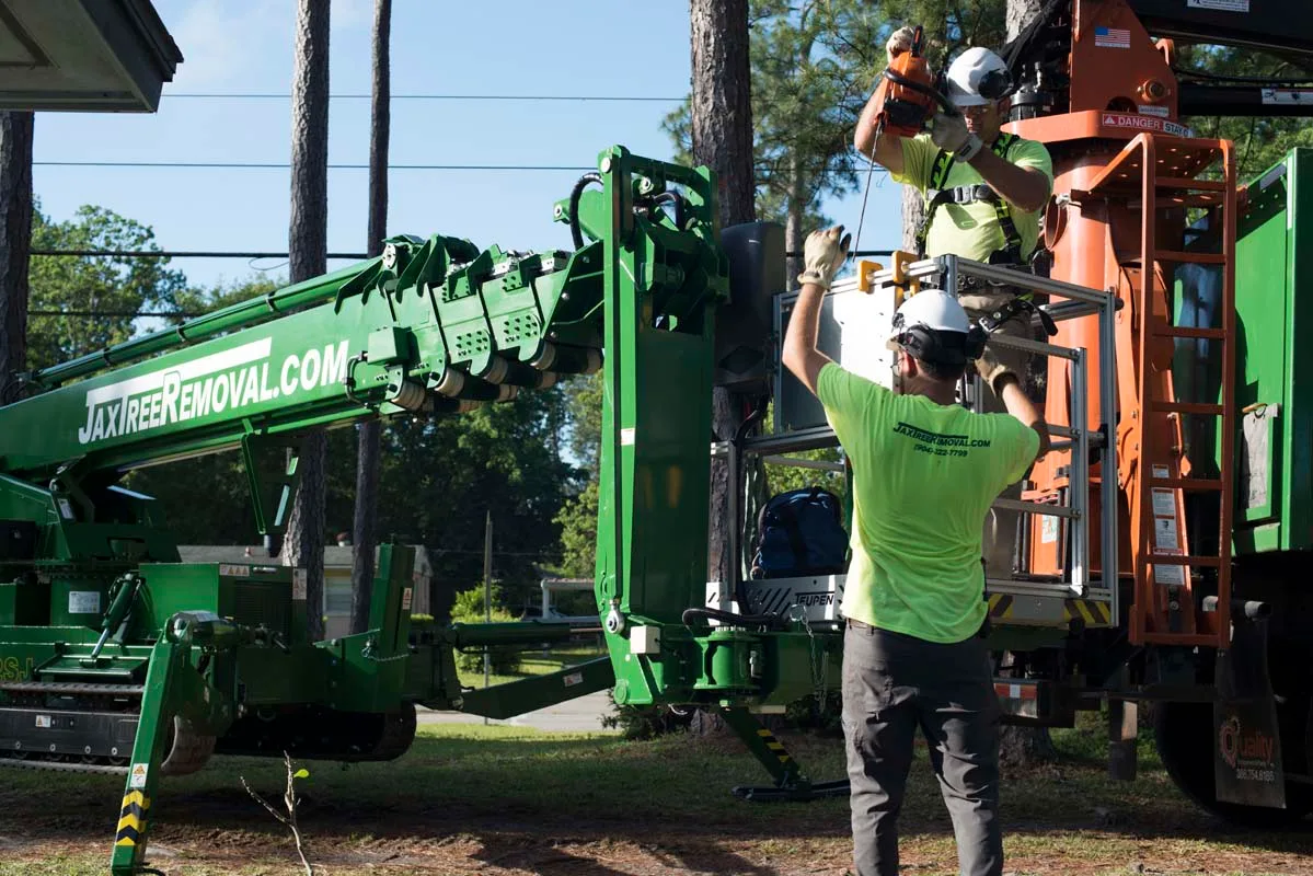 Crew and green spider crane with an aerial lift — tree service in Jacksonville, FL by Jax Tree Removal